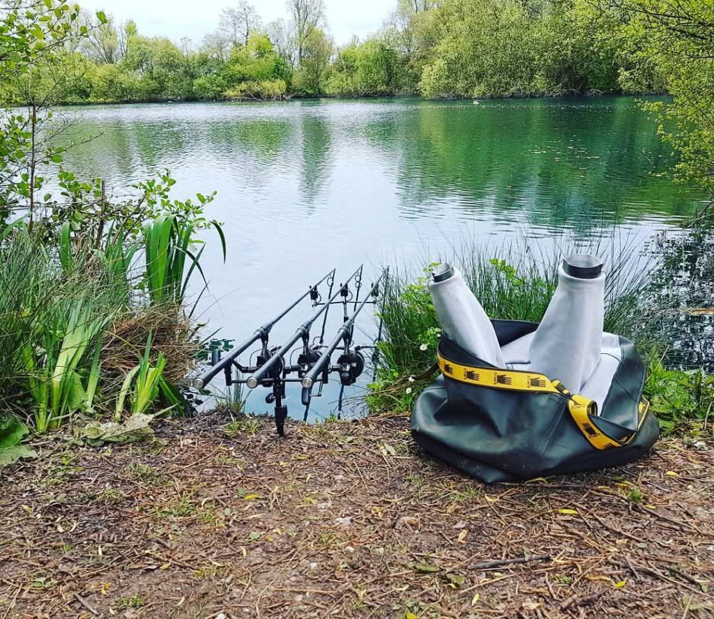 Carp fishing rods set up beside Tockenham Reservoir in Wiltshire