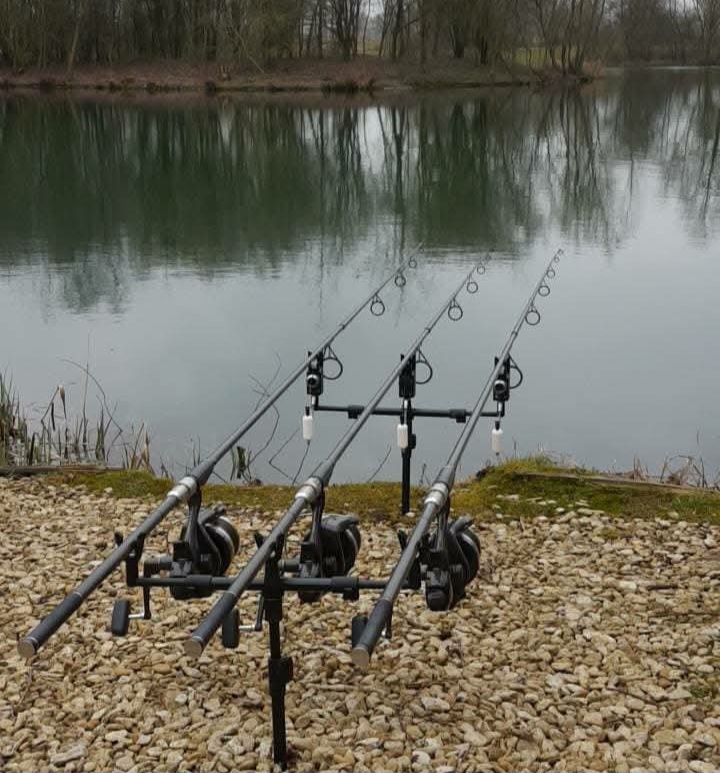 Three carp rods set up on the gravel bank at Hunts Corner Lake, Linear Fisheries, Oxfordshire