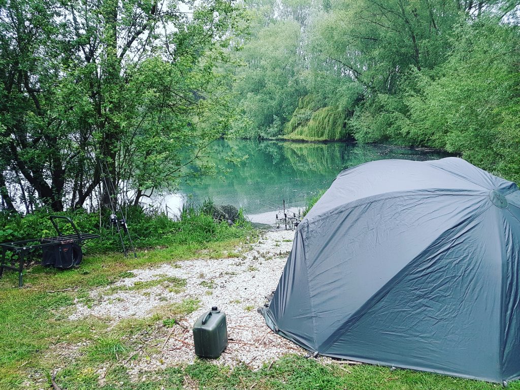 Carp bivvy and rods set up for a night fishing session at Elton Carp & Catfish Lakes, Newnham-on-Severn, Gloucestershire